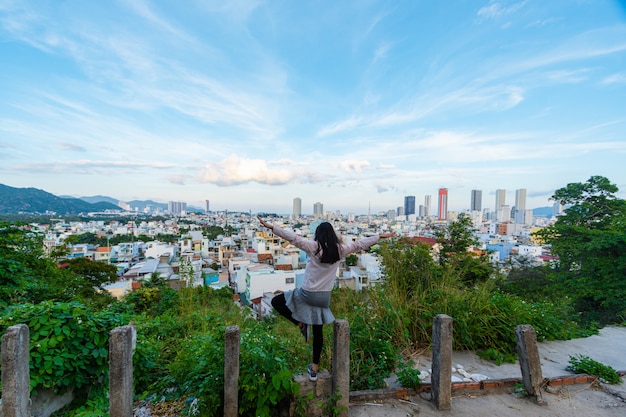 Tourist woman looking at cityscape