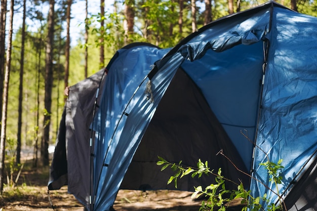 Touristic tent in forest Family camping concept