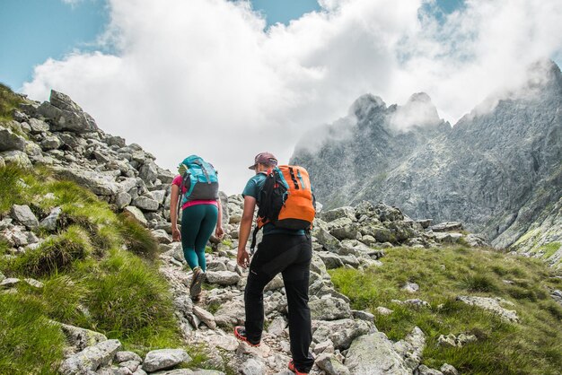 Photo tourists are hiking in the small cold valley to teryho cottage in high tatras slovakia