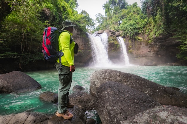 Tourists backpack hiking nature trail traveling ecotourism Tourist to see Haew Suwat Waterfall