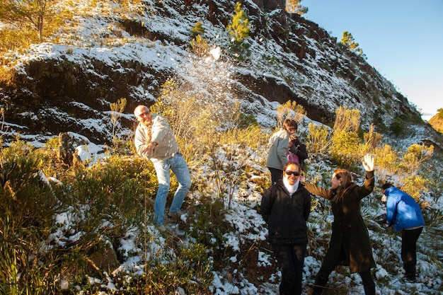 Tourists enjoying the snowcovered Santa Catarina mountain landscape