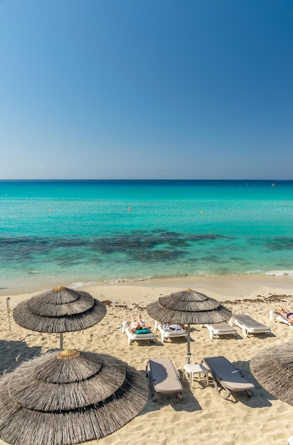 Tourists relax on the famous beach of Cyprus Nissi Beach