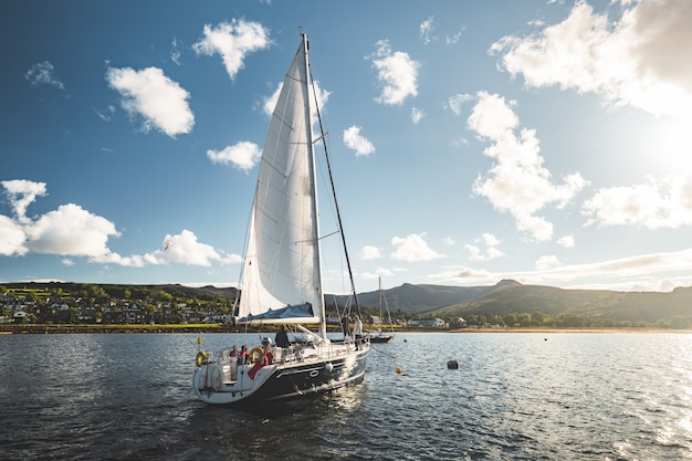 Tourists on the sailing yacht northern ireland breathtaking marine scenery the lone boat on the