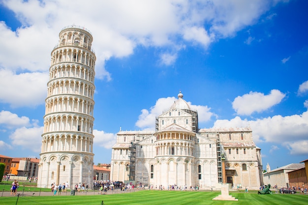 Tourists visiting the leaning tower of Pisa , Italy