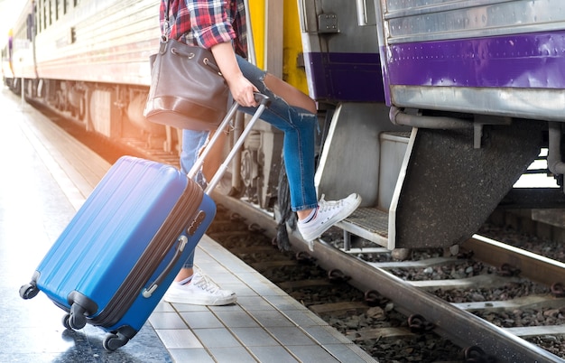 Tourists with luggage are walking on the train