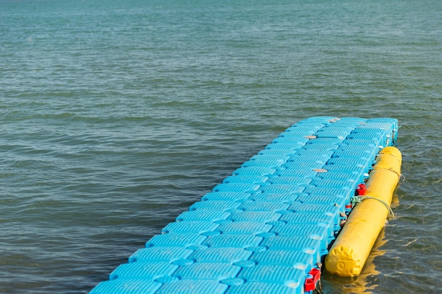 Towed jet ski dock on blue sea background