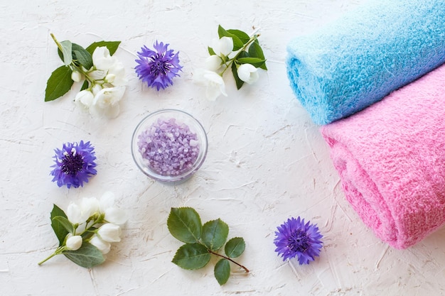 Towels and women cosmetics on a white background