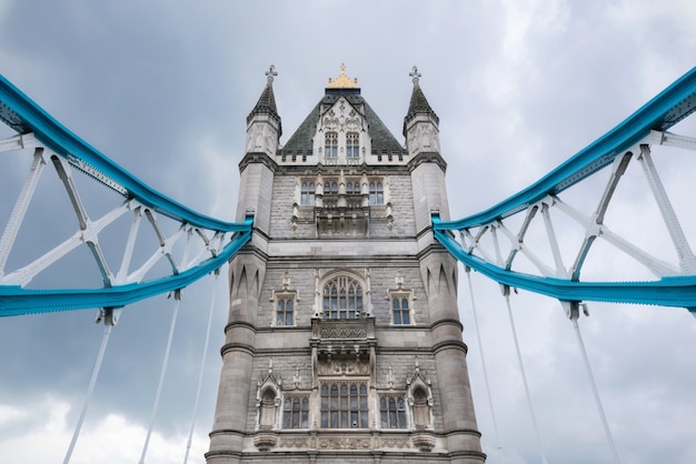 Tower Bridge close up over dramatic cloudy sky.