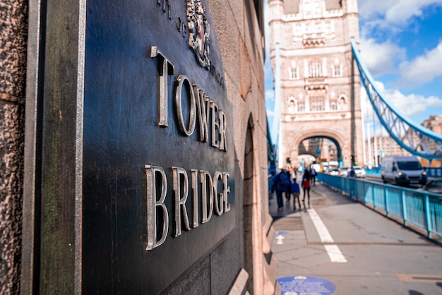 Tower Bridge London Plaque located on the Tower bridge in London. Beautiful lights over the sign.