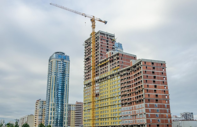 A tower crane on the construction of a new house.