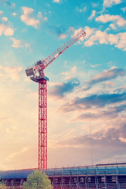 Tower crane on a dramatic sky background