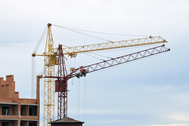 Tower cranes at high residential apartment buildings construction site Real estate development