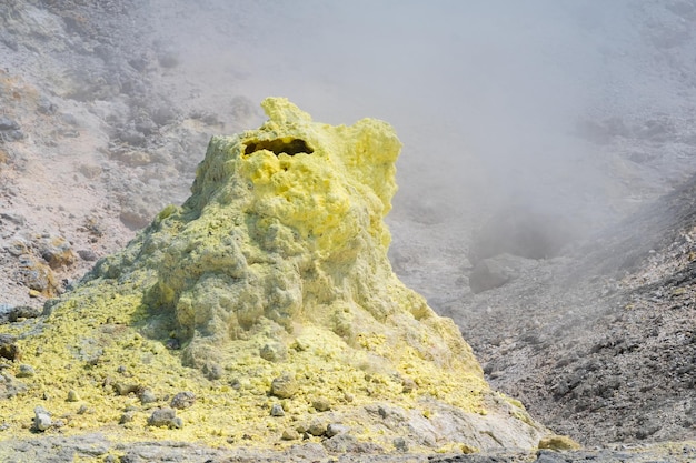 Tower of crystallized sulfur around a fumarole on the slope of a volcano