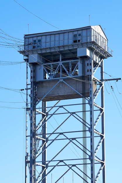 Tower of two-tier vertical lift bridge. Bunk bridge in Kaliningrad city. Blue sky background