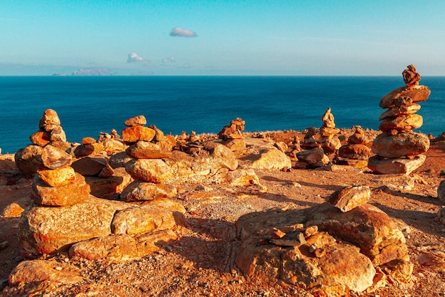 Tower of yellow stones with sand, on the plateau on Madeira Island.