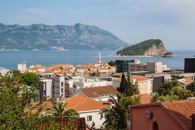 Town by sea against sky