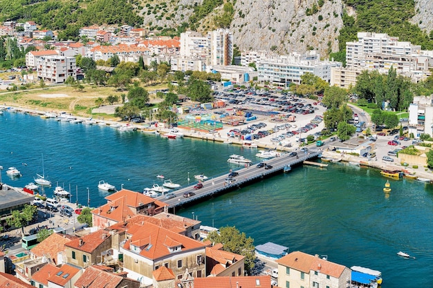 Town and Cetina River flowing into Adriatic Sea in Omis, Croatia