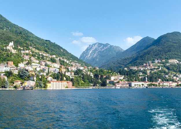 Town on Lake Como coast (Italy). Summer  view from ship board