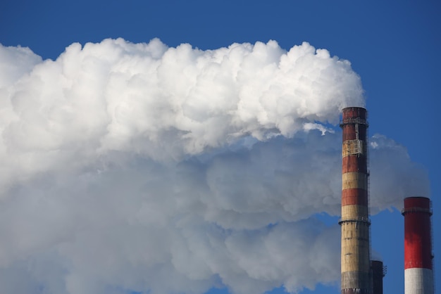 Toxic clouds of smoke come out of factory chimney