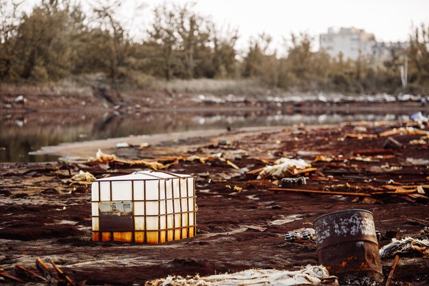 Toxic containers and garbage lying on chemical contaminated waste