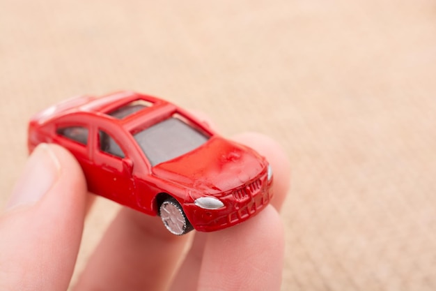 Toy car as a transportation devices in hand