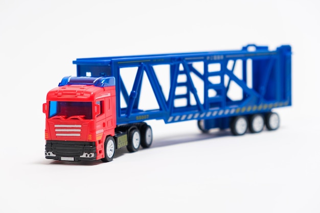 Toy car transporter with cars on a white background