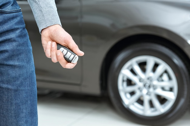 Toy for men Close up shot of a male driver holding car keys