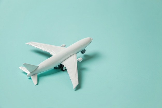 Toy plane on colorful blue background