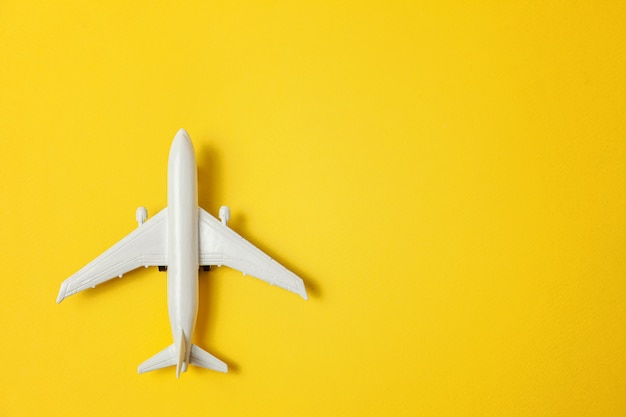 Toy plane on colorful yellow background