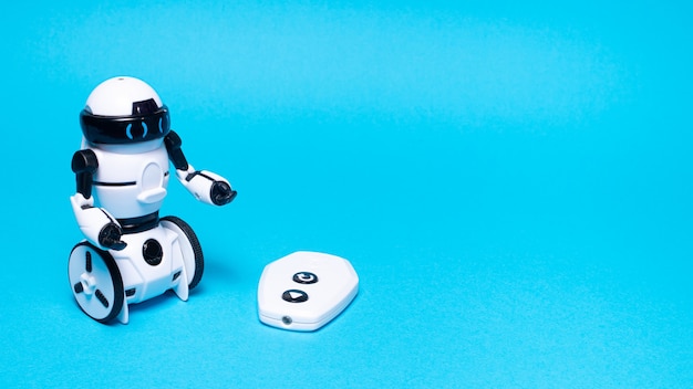 A toy robot on a blue background. with place for text.