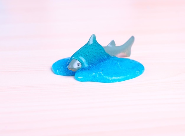 Toy Shark drowning in a blue slime