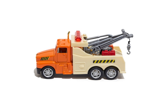 Toy tow truck on a white background Childrens car for transporting cars side view