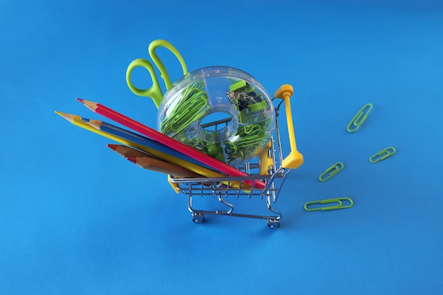 Photo toy trolley with stationery on bright background top view concept of back to school