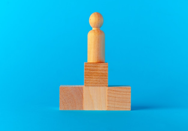 Toy wooden blocks on blue background front view