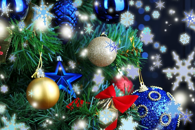 Toys on Christmas tree on  Christmas lights background