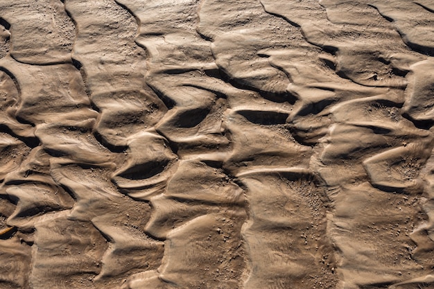 Traces of flowing water on the sand