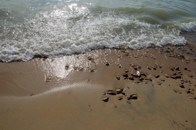 Traces of waves on the sand The waves wash over the sandy beach