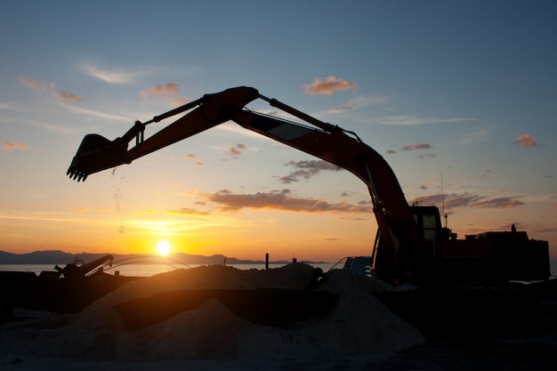 Track-type loader excavator machine doing earthmoving work