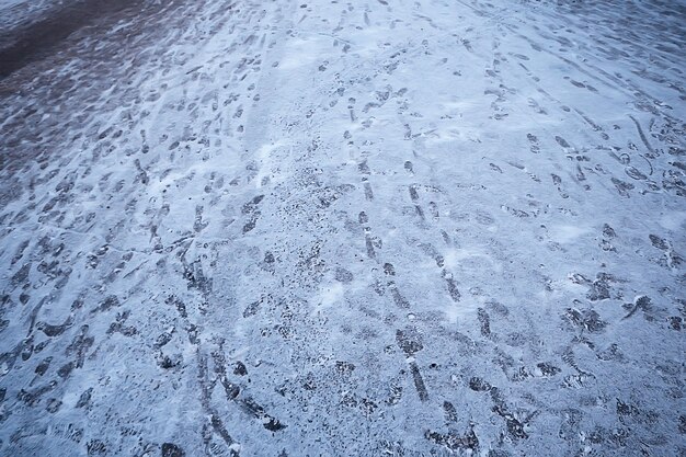 tracks asphalt snow, ice, people’s tracks from shoes on snow, snow removal weather