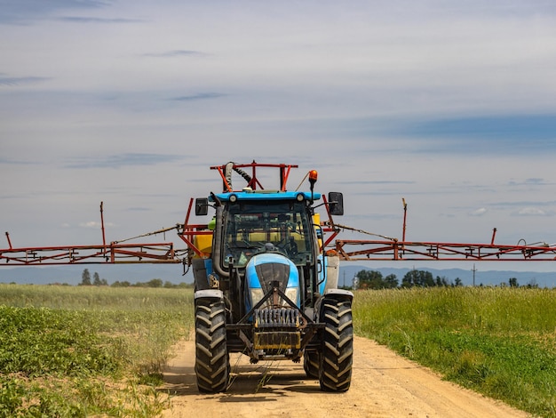 Photo tractor goes to spray plant protection products