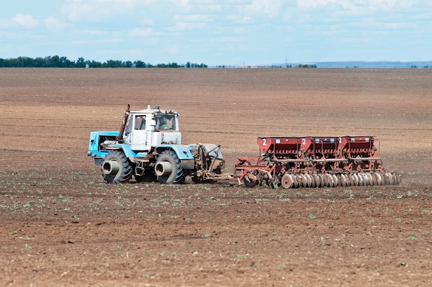 Tractor with seeder, sowing works