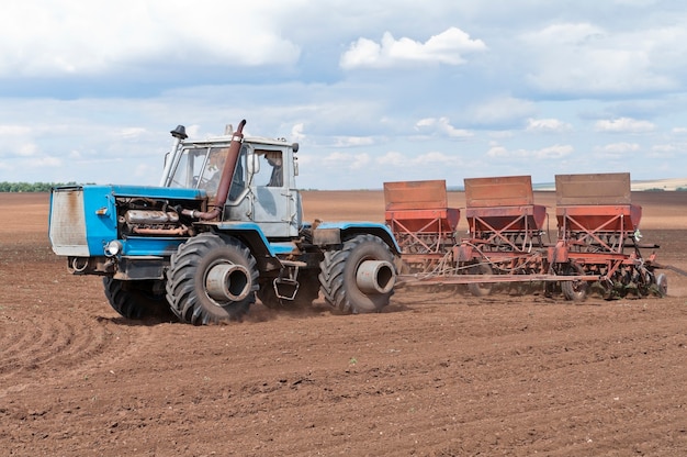 Tractor with seeder, sowing works