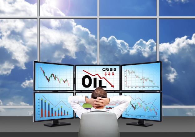 Trader looking on statistics fall in oil prices