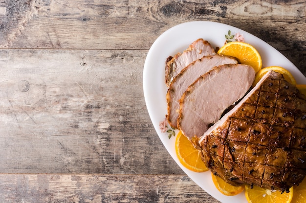 Tradicional homemade honey Glazed Ham for holidays copy space