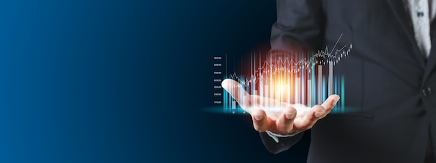 Trading bar graph on hand businessman, stock exchange marketing analyzing chart. information statistics diagram profit. investment and marketing concept.