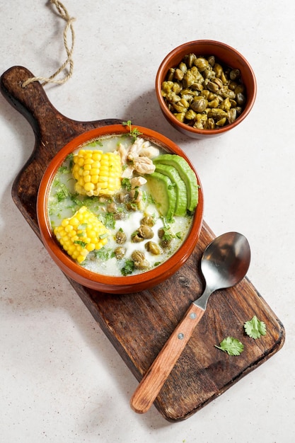 Traditional Ajiaco Colombiano Colombian Soup with potato chicken avocado common in Colombia Cuba and Peru Latin America