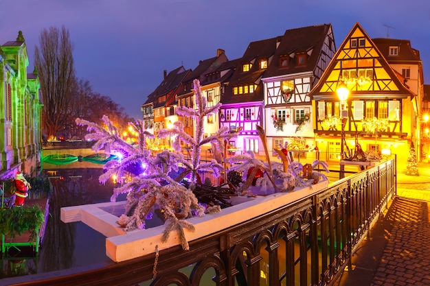 Traditional Alsatian half-timbered houses in Petite Venise, old town of Colmar, decorated and illuminated at christmas time, Alsace, France