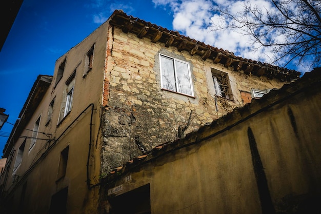 Traditional architecture with balconies and old windows, city of Segovia in Spain