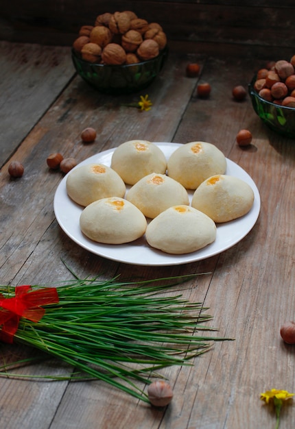 Traditional Azerbaijani holiday cookies shakar chorek on white plate on rustic