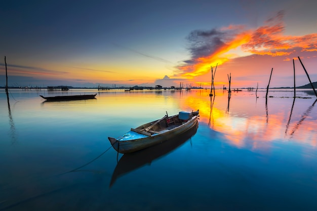 Traditional boats fishing  a beautiful sunset in the fishing village